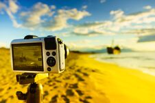 Camera On Tripod And Shipwreck Stock Photos