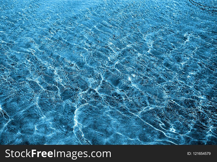 Photo of a macro background of blue sea waves. Photo of a macro background of blue sea waves