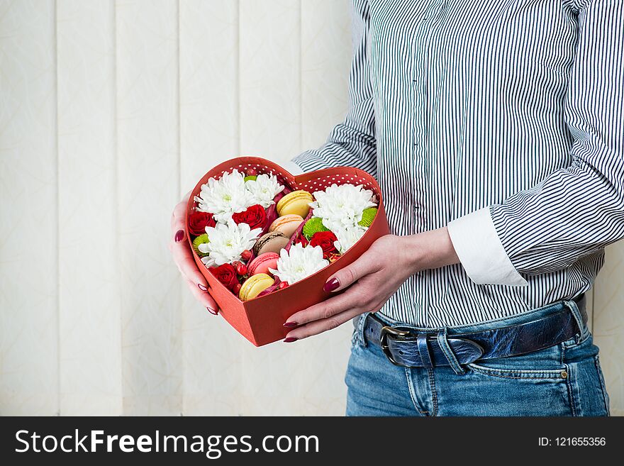 Red Box-heart With Flowers And Macaroons In Female Hands Close-u