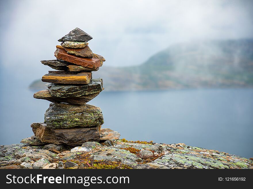 Pyramid Of Rocks Stones on mountain background, Norway