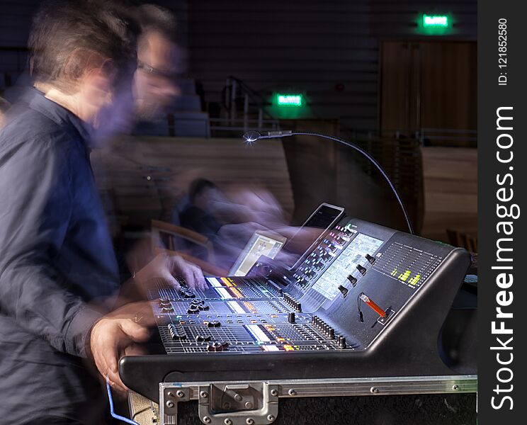 Music, technology, people and equipment concept - hands using mixing console in sound recording studio. Music, technology, people and equipment concept - hands using mixing console in sound recording studio