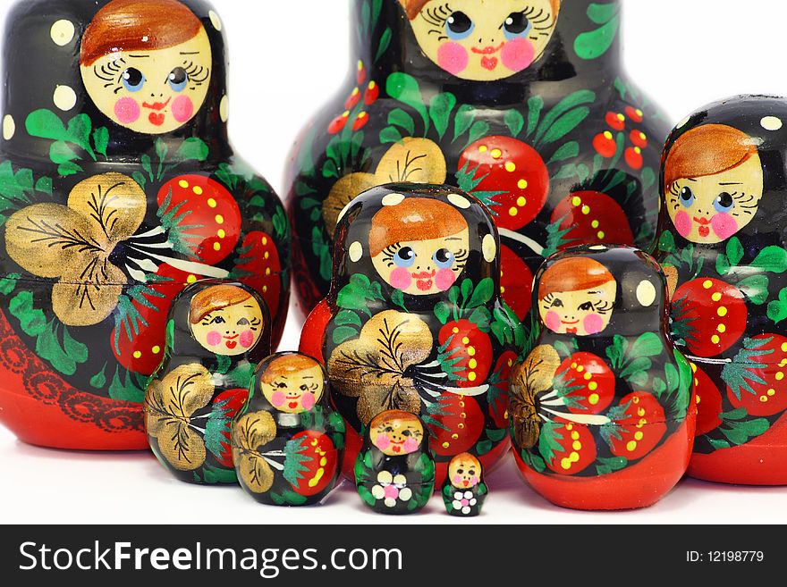 Multi-coloured bright wooden Russian children's toys of a doll. Mass production. Multi-coloured bright wooden Russian children's toys of a doll. Mass production.