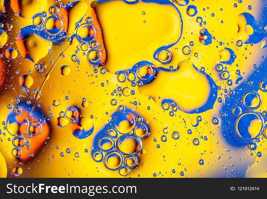 Macro Shot Of Oil Bubbles With Water On Colorful Background. Space And Universe Planets Styled Abstract Image