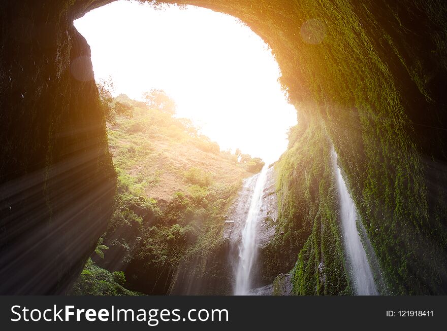 Madakaripura Waterfall with sunlight effect is the tallest water