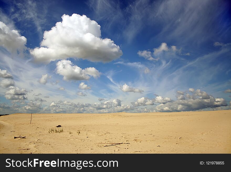Stunning beautiful clouds on a background of sand