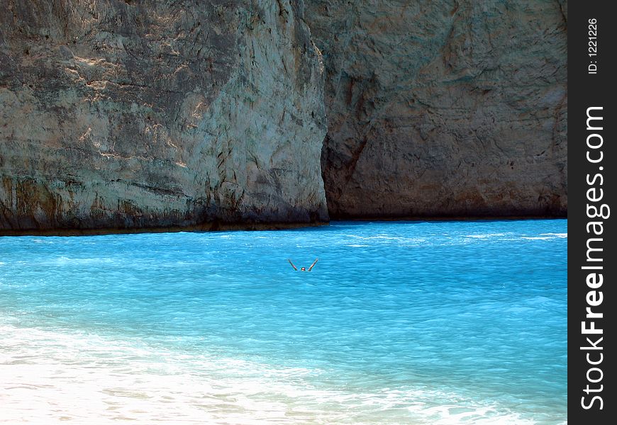 Fabulous beach with turquoise waters and woman waving and having fun - you can almost taste the surf!. Fabulous beach with turquoise waters and woman waving and having fun - you can almost taste the surf!