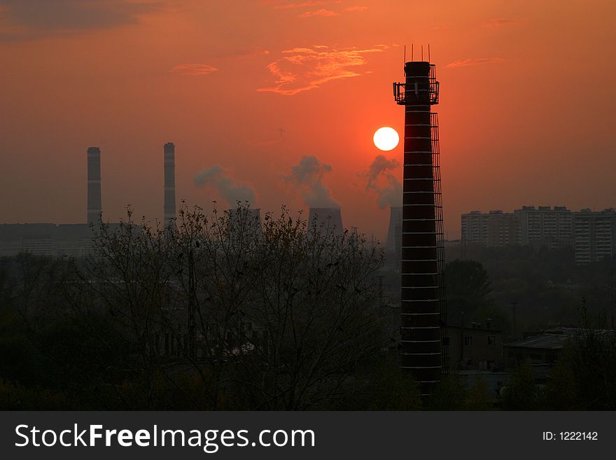 Factory pipes on a sunset