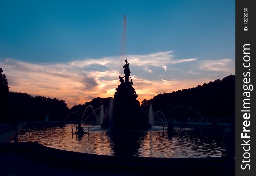 Sunset at the fountain in front of the castle Herrenchiemsee