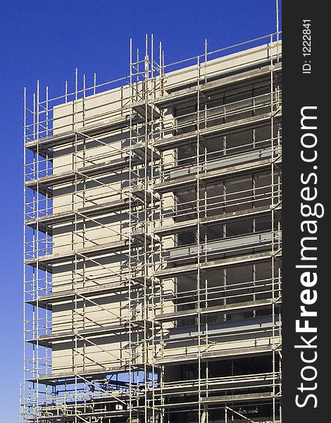 Building under construction structure with a blue sky