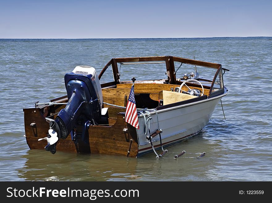 A 1963 Henry outboard with Evenrude motor, anchored off shore of Lake Erie, Cleveland Ohio. A 1963 Henry outboard with Evenrude motor, anchored off shore of Lake Erie, Cleveland Ohio.