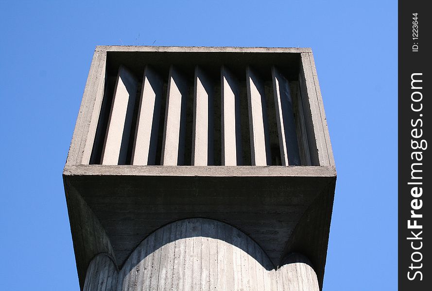 Large concrete vent with blue sky