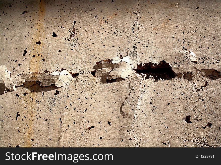 Concrete wall with big cracks