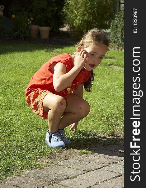 Young girl sitting on green gras. Young girl sitting on green gras