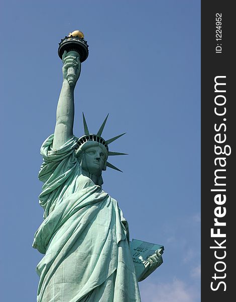 Statue of Liberty, clear blue sky in background