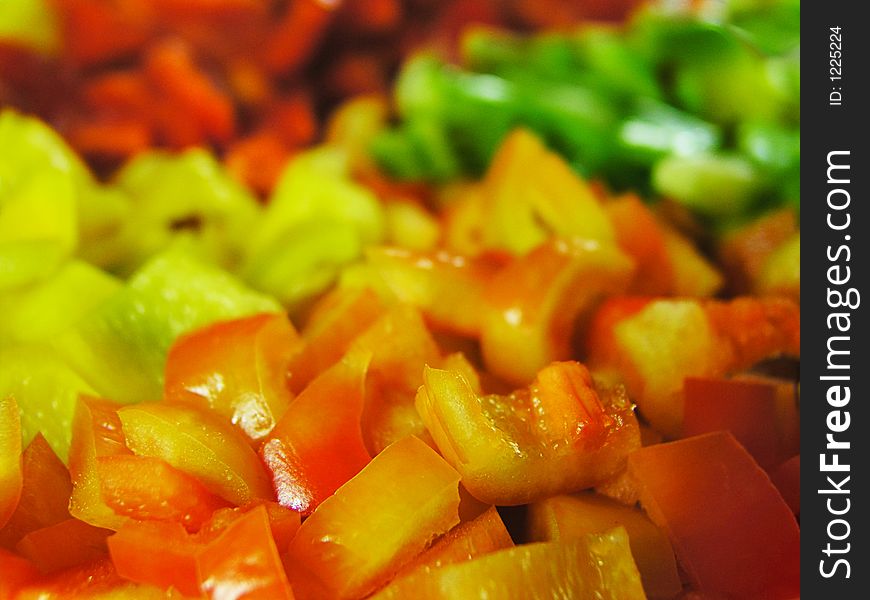 Four colors slice of paprika. Orange slices in front of view. Focus to the foreground. Four colors slice of paprika. Orange slices in front of view. Focus to the foreground