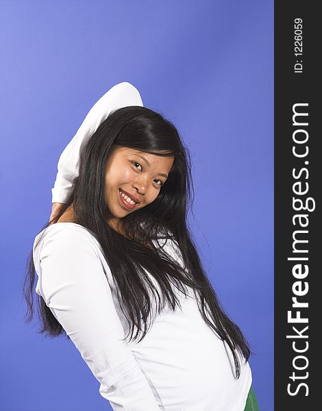 Girl posing over blue background