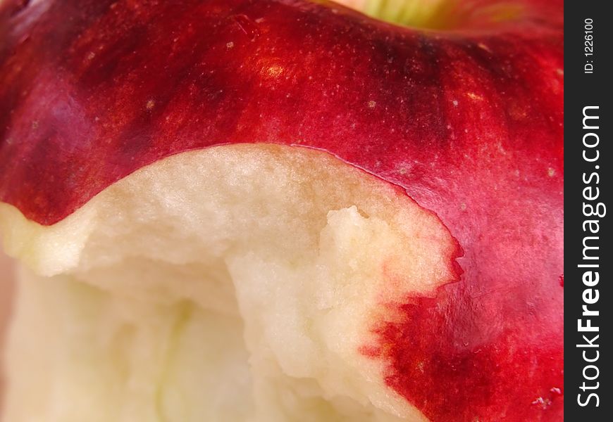 Extreme close-up of an apple with a bite missing