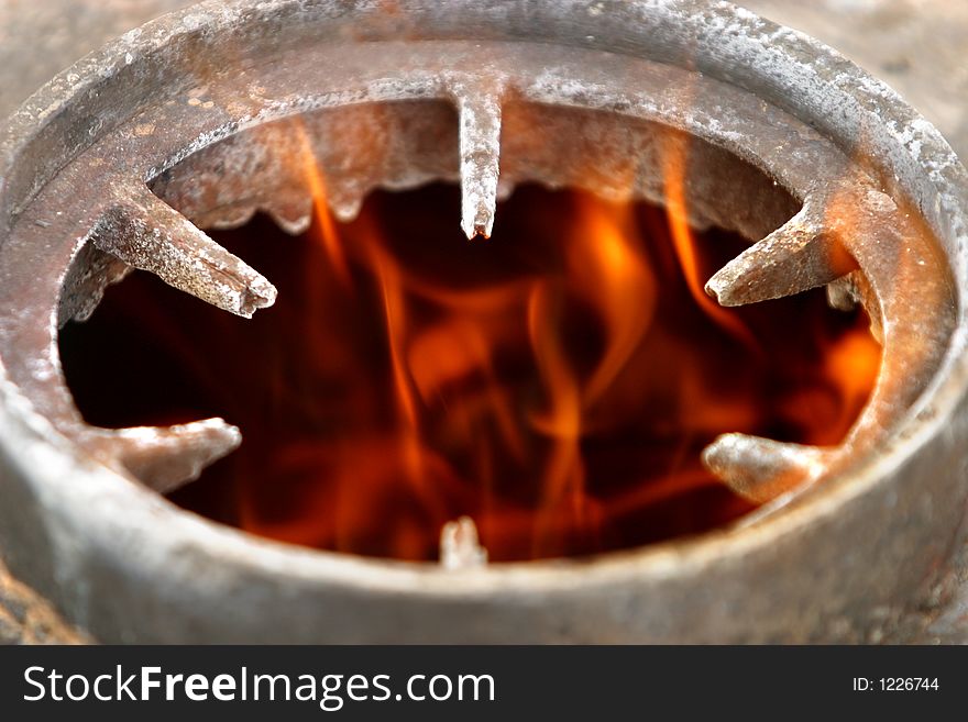 The image of fire in a metal washer