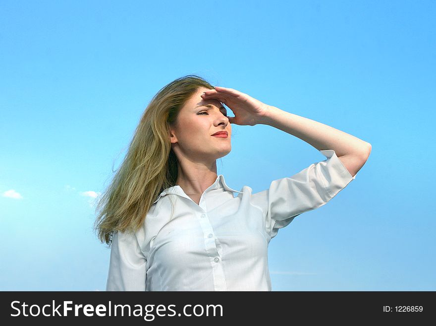 Beautiful caucasian woman smiles confident in the clear sunlight. Beautiful caucasian woman smiles confident in the clear sunlight