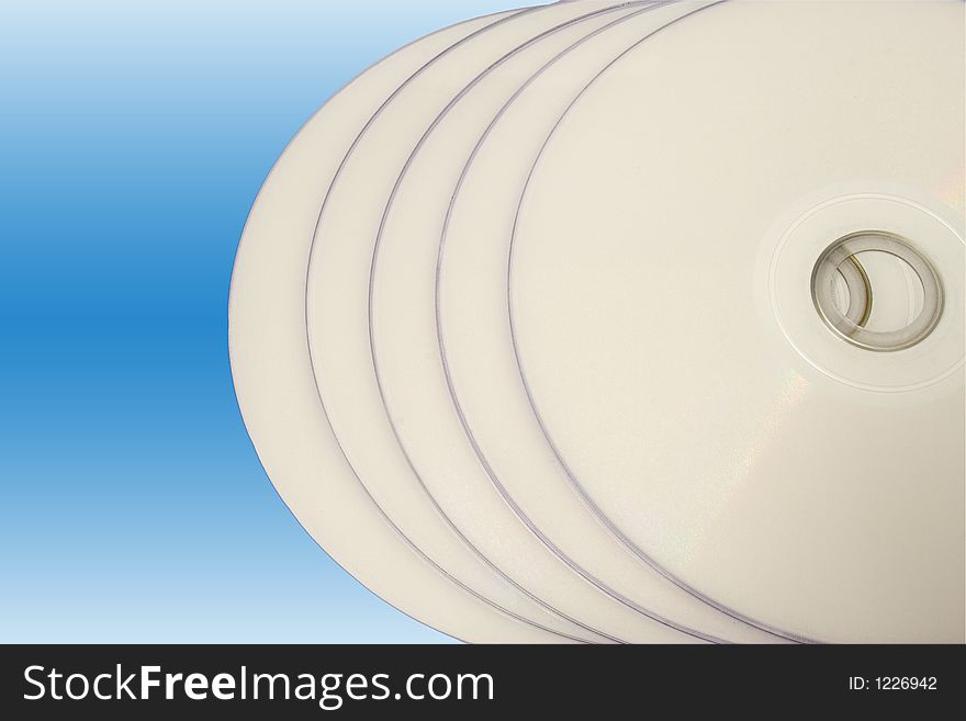 Close up of compact discs with copy space. Isolated on a gradient background. Close up of compact discs with copy space. Isolated on a gradient background