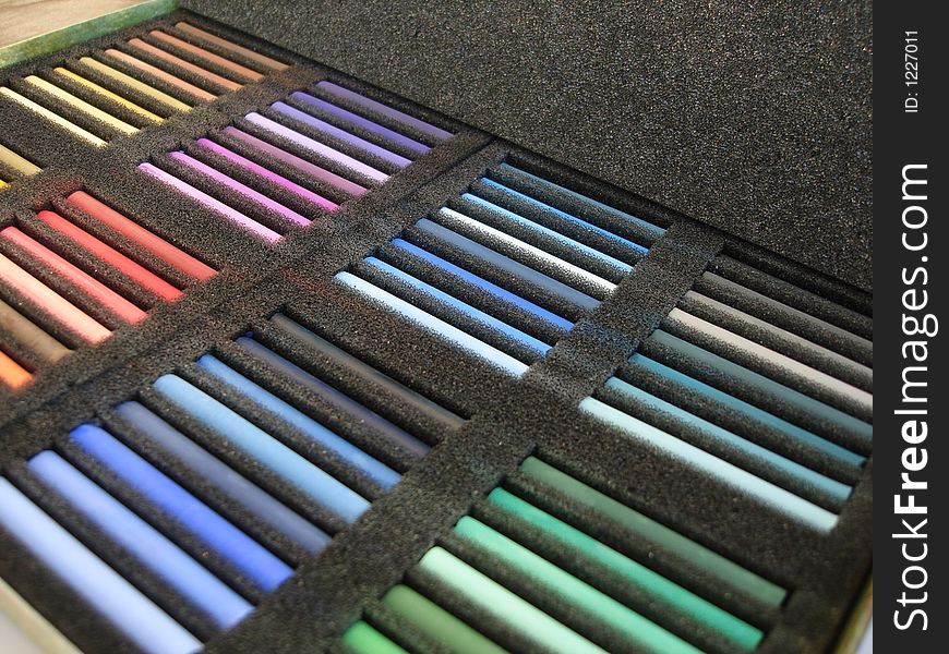Set of color crayon in a black box. Set of color crayon in a black box