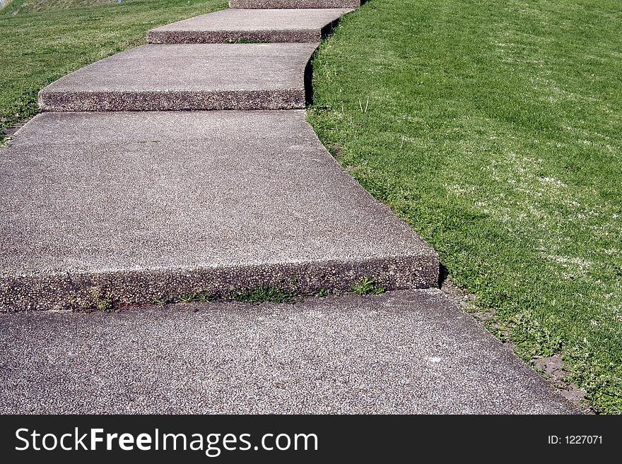 Cobblestone Footpath Curve With Stairs On Grass