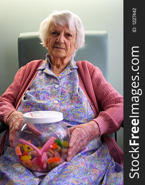 Beautiful 93yr old Senior citizen holding jar of lollies