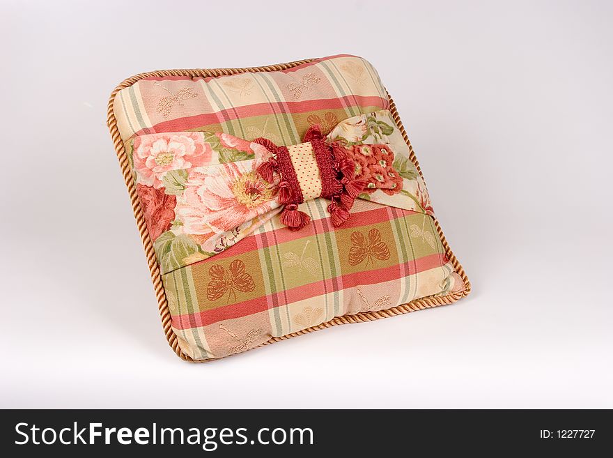 Isolated View of Beige and Red Plaid Pillow with Tassels