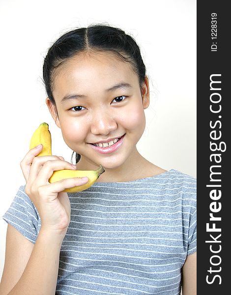 Pretty girl holding banana as a phone. Pretty girl holding banana as a phone.