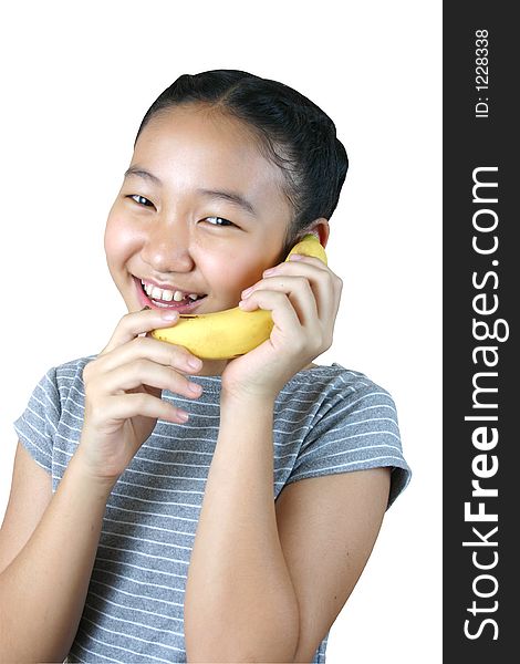 Pretty girl holding banana as a phone. Pretty girl holding banana as a phone.