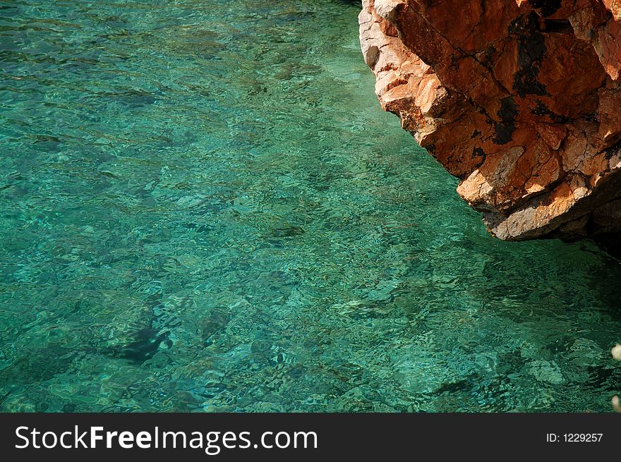 Pure sea water and a rock