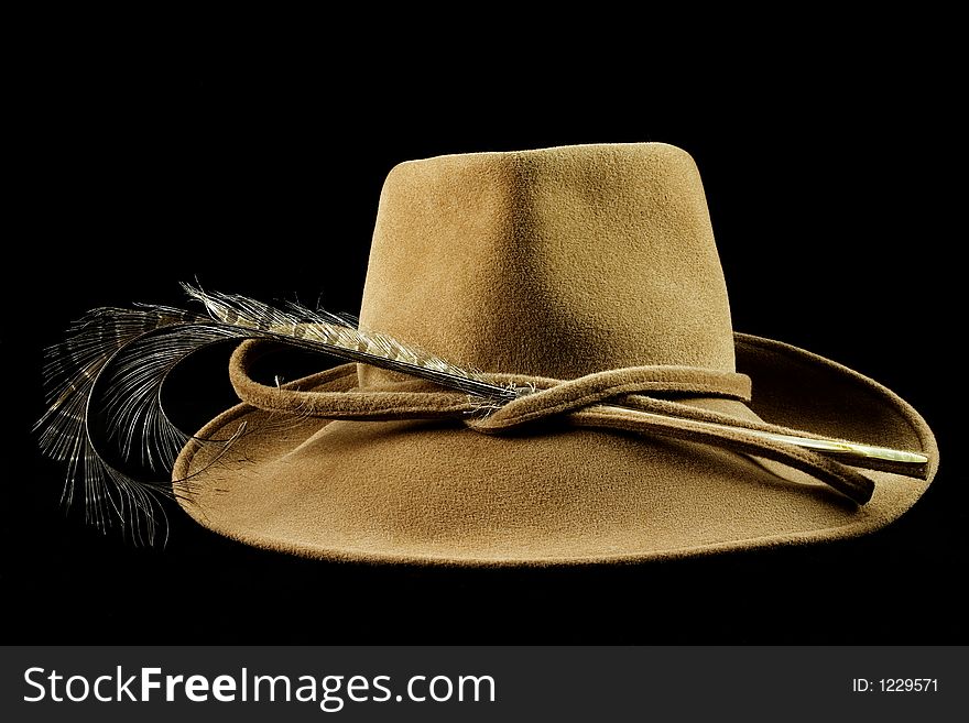 Lady's hat on black background isolated with ostrich plume. Lady's hat on black background isolated with ostrich plume