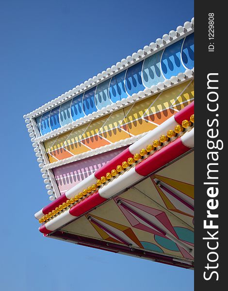 Top of the Colorful carousel on sky background at oktoberfest in munich. Top of the Colorful carousel on sky background at oktoberfest in munich