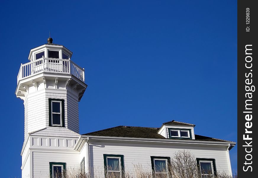 A lighthouse set up on a hill.