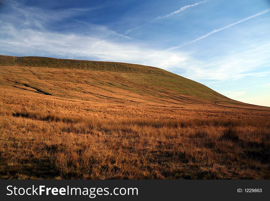 An eroded barren mountain in the brecon beacons national park south wales UK. An eroded barren mountain in the brecon beacons national park south wales UK