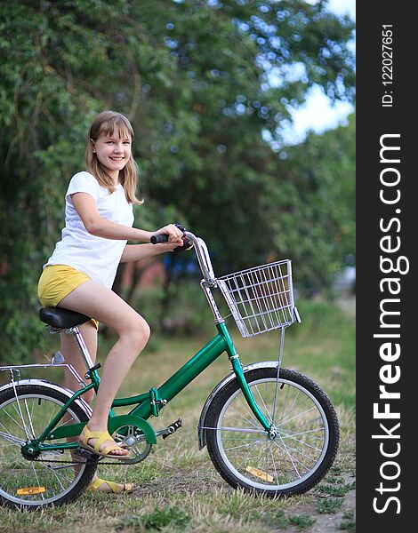 Teenage girl with a bike-riding