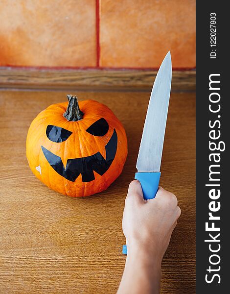 Preparation of carving jack-o-lantern pumpkin for Halloween