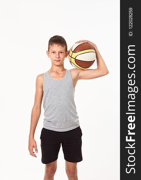 Teenager with a basketball on a white background.