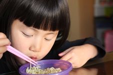 Asian Girl Eating Noodles Stock Image Asian Girl Eating Noodles Stock Image