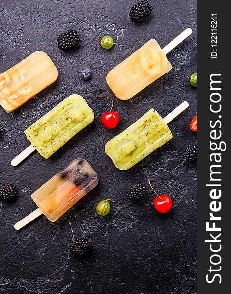 Photo of ice cream on stick, blackberry ,cherry, gooseberry