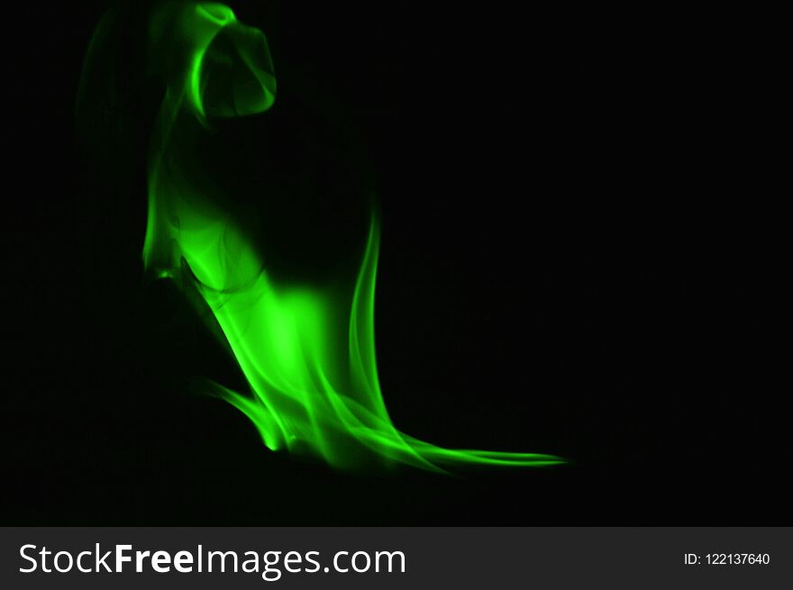 Beautifu green fire flames on a black background.