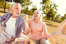 Extremely Happy Wife Looking At Husband Blowing Soap Bubbles Stock Image Extremely Happy Wife Looking At Husband Blowing Soap Bubbles Stock Image