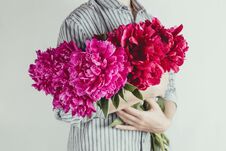 Portrait Of Woman Holding Bouquet Of Violet And Purple Flowers Stock Photography