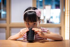 Asian Little Chinese Girl Drinking Hot Green Tea Royalty Free Stock Image