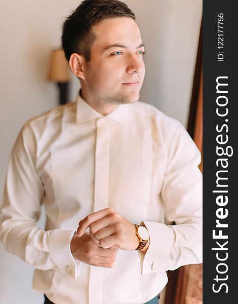 Half-length Portrait Of The Handsome Groom Looking Through The Window.