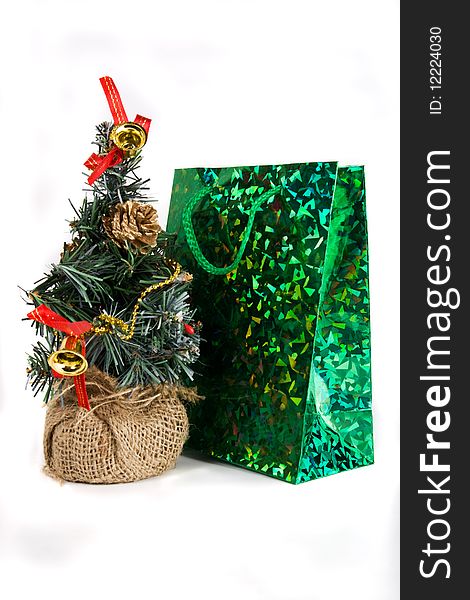 Decorative firtree and green shiny package for gifts. Decorative firtree and green shiny package for gifts