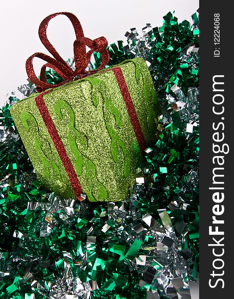 Green sparkling gift box for Christmas and spangle on white background. Green sparkling gift box for Christmas and spangle on white background