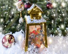 Christmas Handmade Decorated Lantern With A Picture Of Fairy-tale Baba Yaga On The Glass. Fir-tree Background With Lights Stock Photo