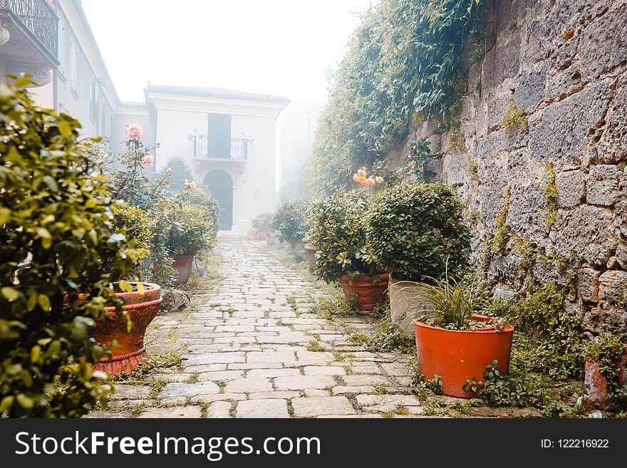 San Marino cityscape on a misty day. Historic street of San-Marino in fog. Italy.