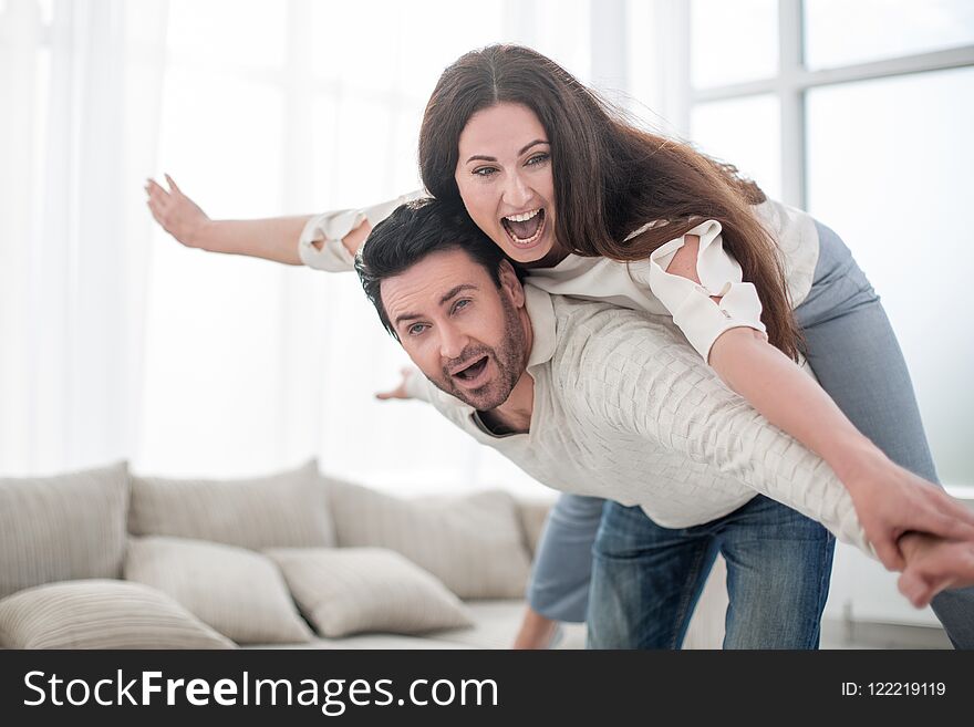 Happy couple resting in a spacious living room.photo with copy space